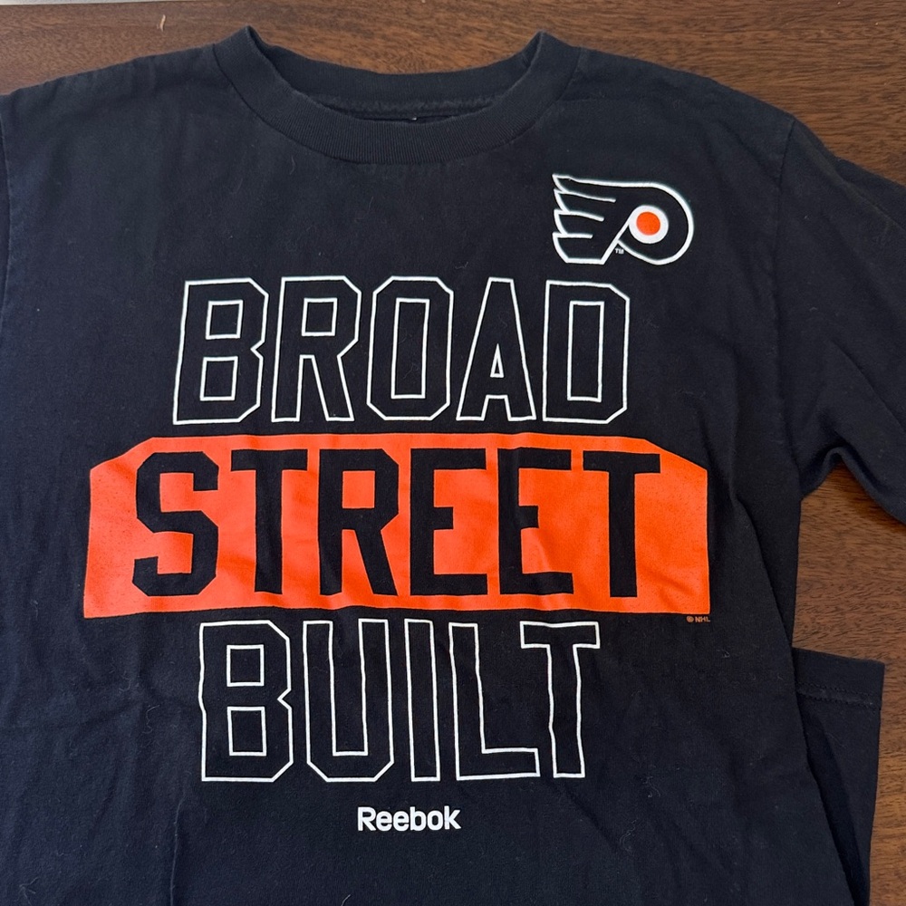 Reebok Kids Black and Orange Broad Street Tee